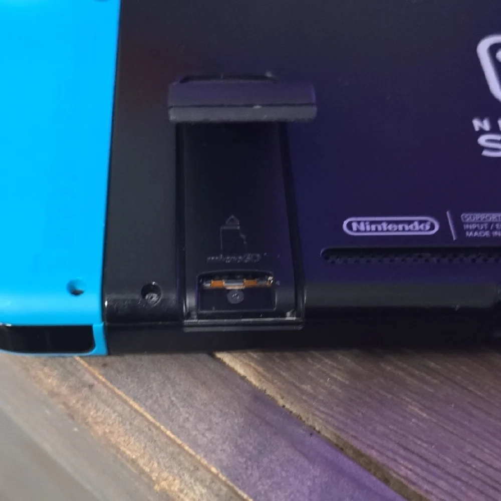 Nintendo Console with Vibrant Red and Blue Controllers